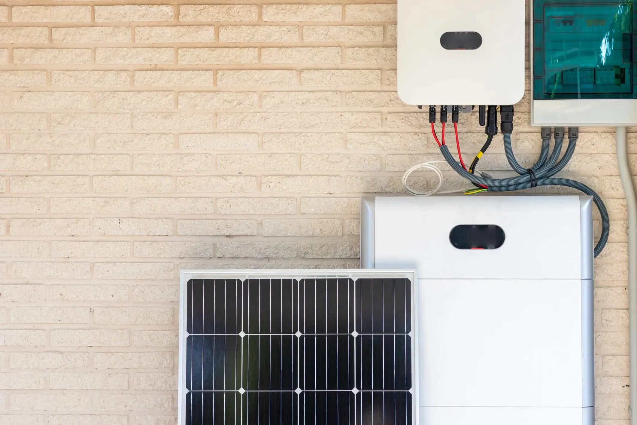 Home battery storage units beside a residential solar energy system
